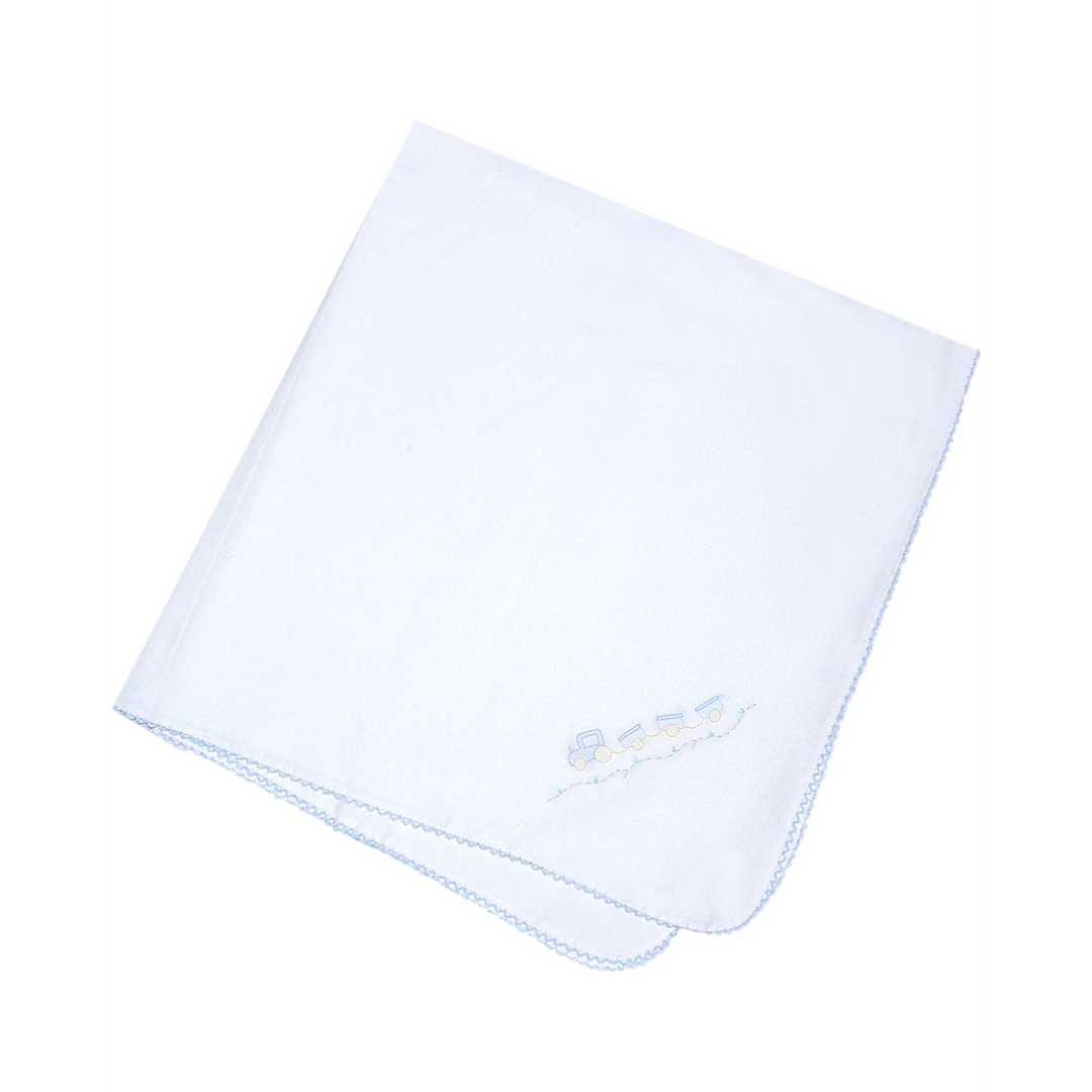 That Store white baby receiving blanket with a delicate shadow stitched train design and blue scalloped edge trim.