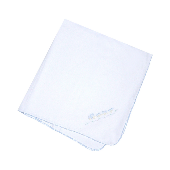 That Store white baby receiving blanket with a delicate shadow stitched train design and blue scalloped edge trim.