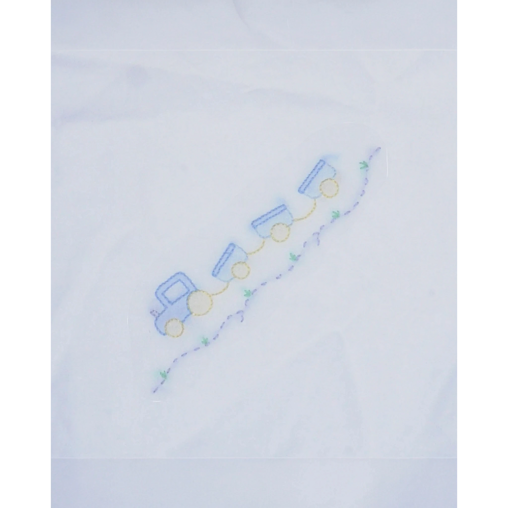 That Store white baby receiving blanket featuring a delicate blue and yellow shadow stitched train design
