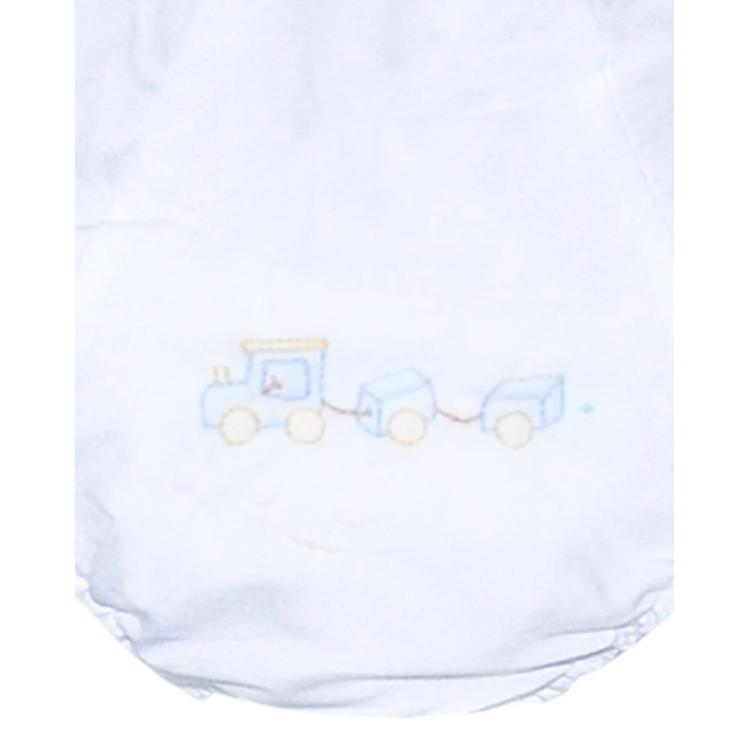 That Store white baby boy diaper cover featuring a blue embroidered train design with delicate shadow stitching.