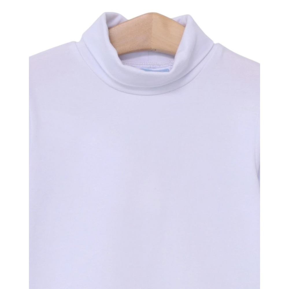 That Store white Taylor turtleneck for children made from soft cotton and spandex blend on a wooden hanger