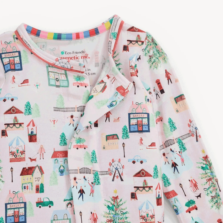 That Store Winter Village print modal baby footie with magnetic closures and colourful striped neck trim
