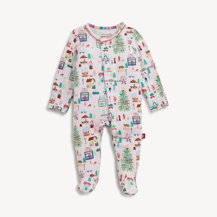 That Store baby footie in soft modal fabric featuring a festive winter village print with magnetic closures