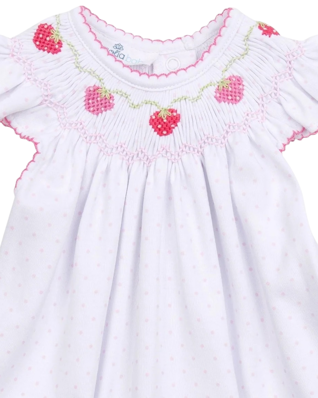 White dress with pink berry smocking  on a white background