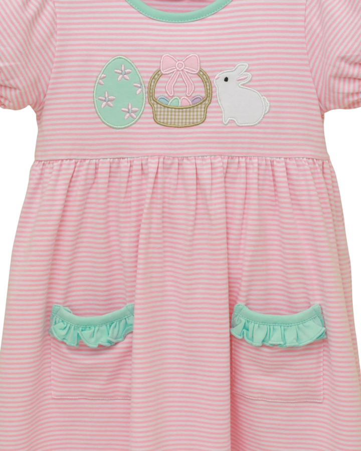 Pink striped dress with Easter-themed appliqués on a white background